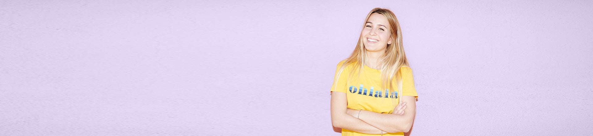 Blonde girl smiling with Benzac purple background